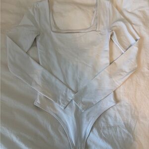 Aritzia Babaton Cream Long Sleeve Bodysuit